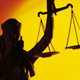 A statue of the symbolically blindfolded Roman goddess Iustitia carries the scales of justice.
THINKSTOCK